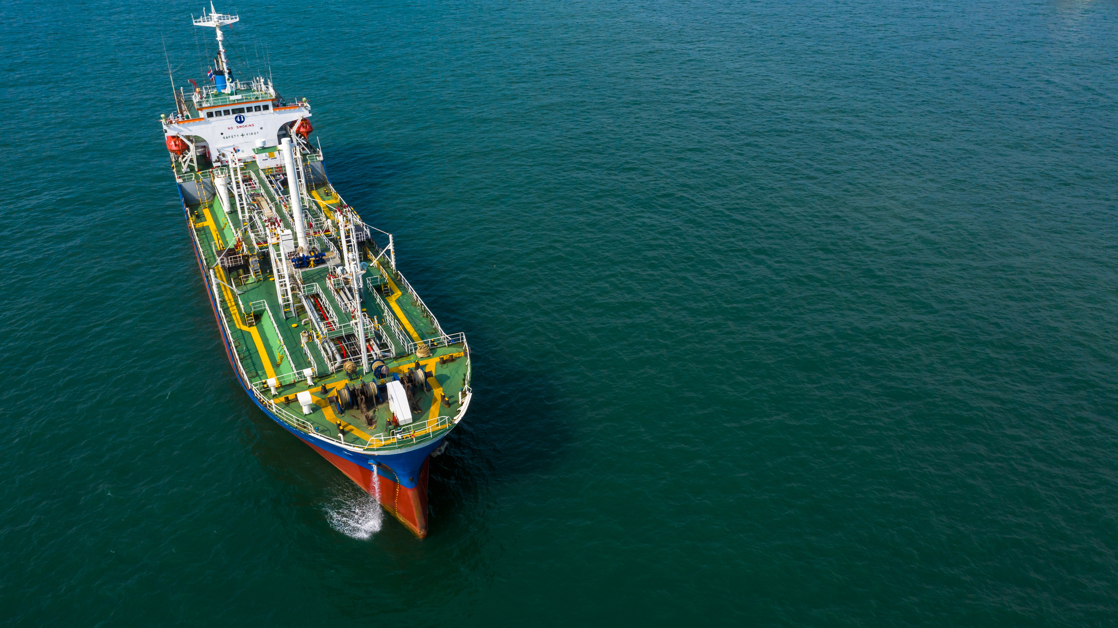 Aerial view oil tanker petrochemical offshore in open sea, Refinery industry cargo ship, Oil product tanker at sea view from above, Aerial view oil tanker ship vessel.