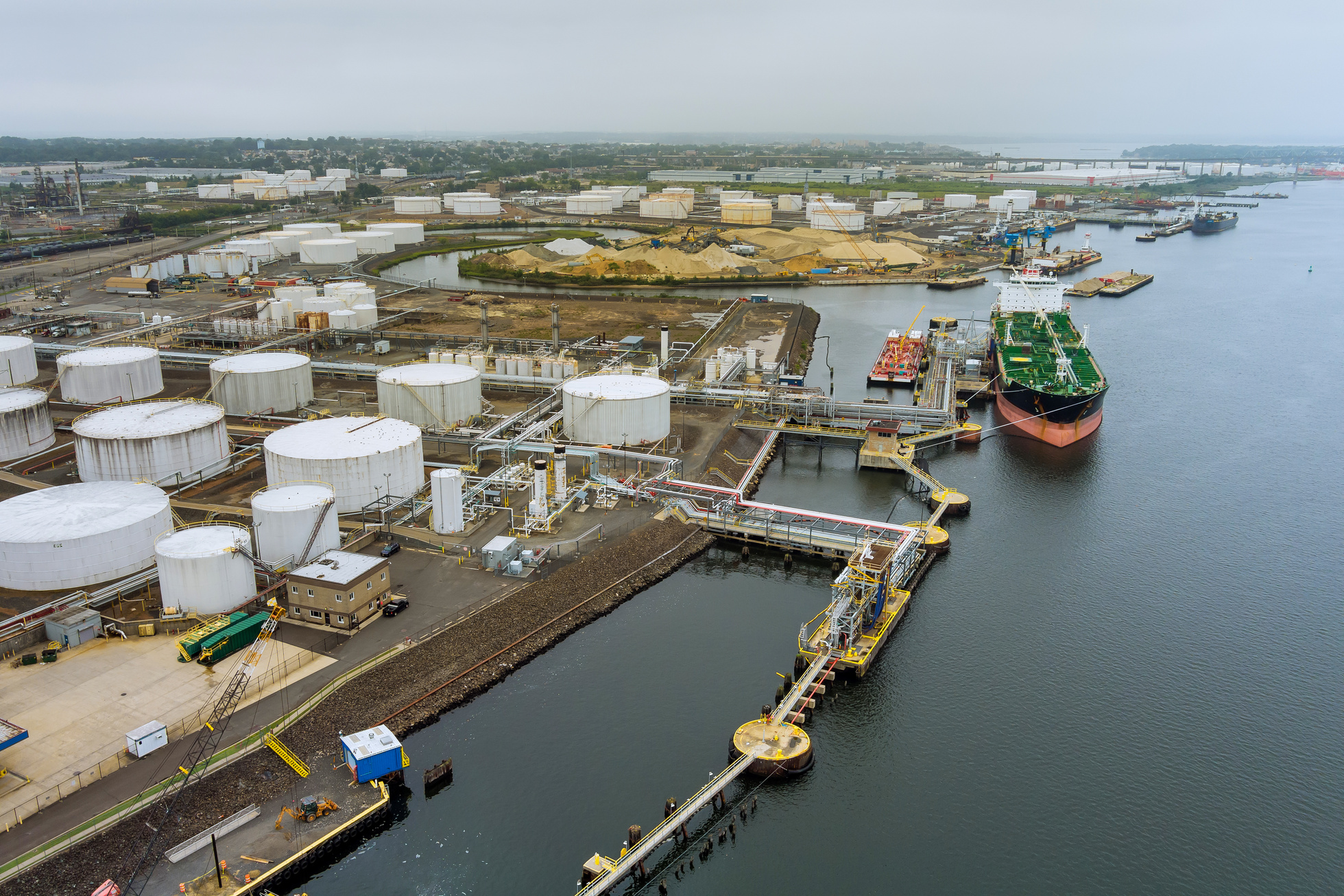 Cargo oil tanker is transferring oil to the crude oil storag