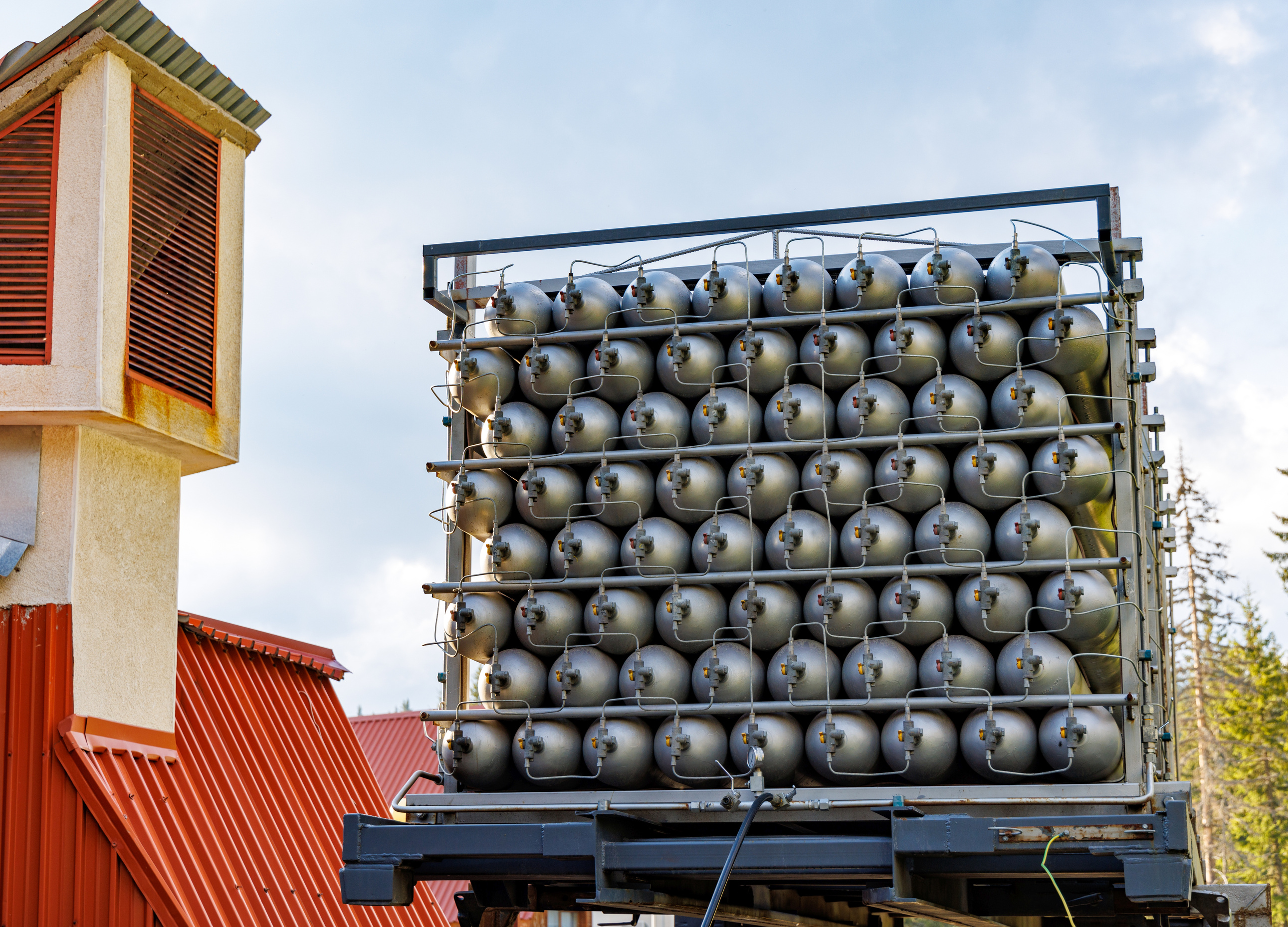 A Lot of Bottles Filled with Gas or Gasoline Are Stacked in Piles