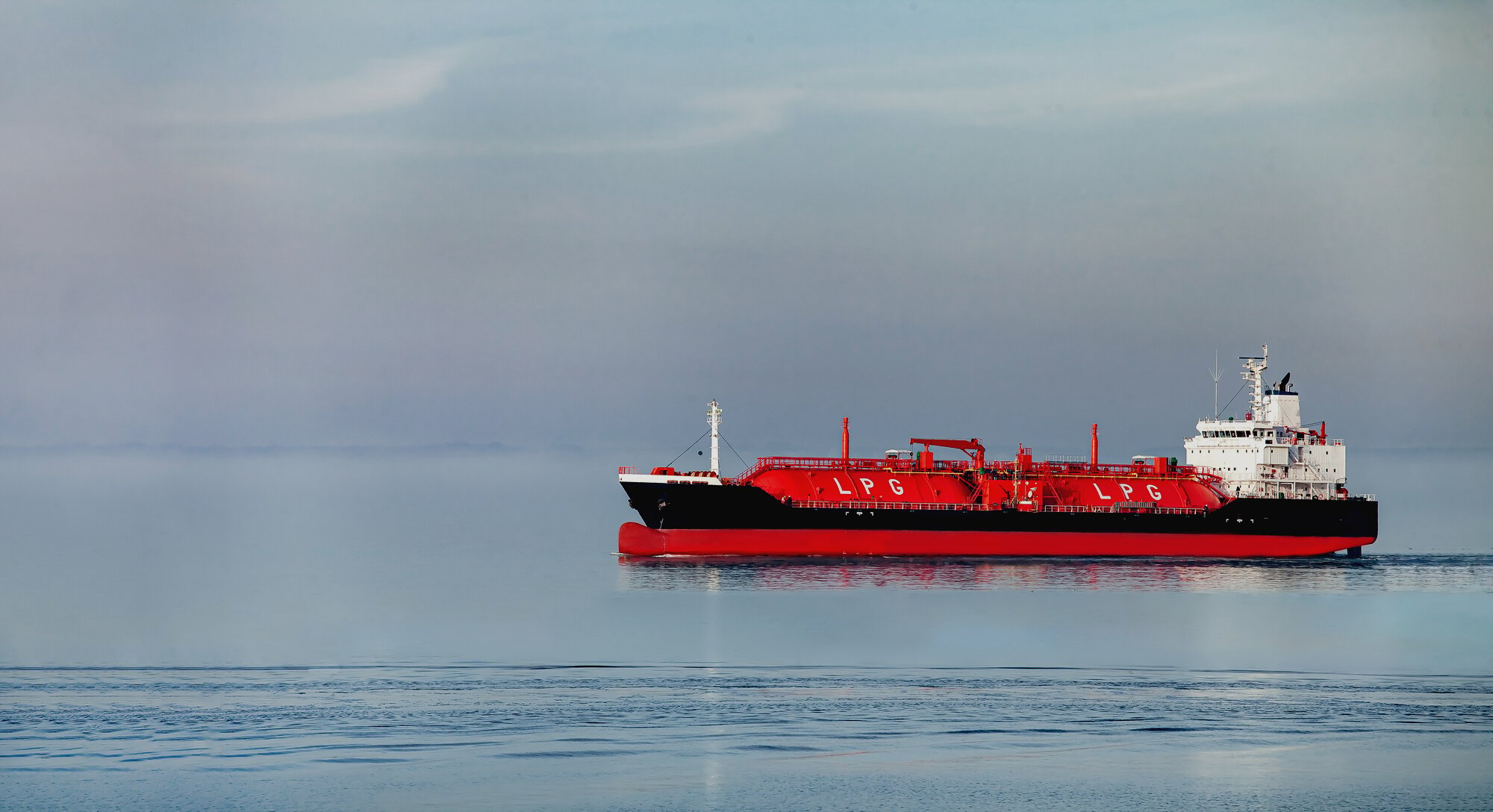 Side view oil and gas petrochemical tanker offshore in opensea, Refinery industry cargo ship, Oil product tanker and LPG tanker at sea view from above, Aerial view oil tanker ship vessel.